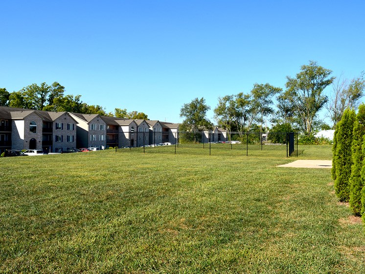 Dog park located next to apartment buildings
